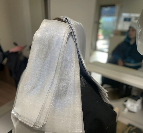 Foil highlights being applied to a client's hair at Salon Deelegance, Caddens